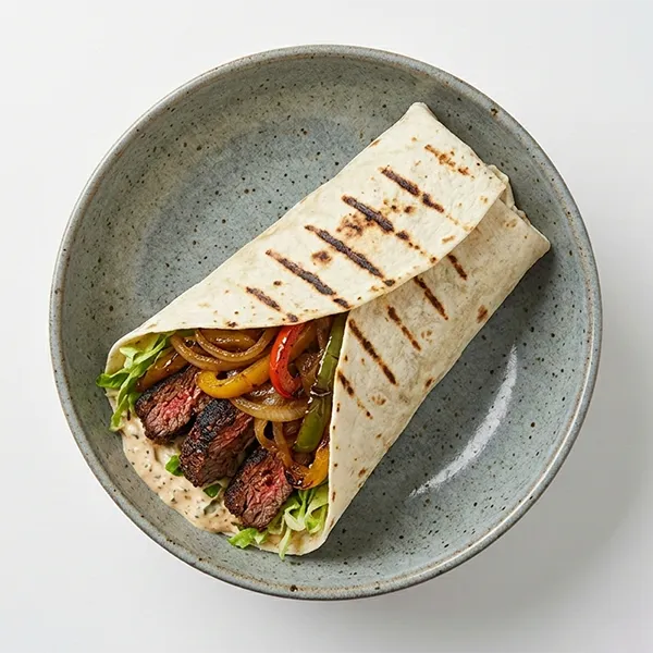 Grilled Cajun Beef Wrap with Caramelized Onions and Bell Peppers